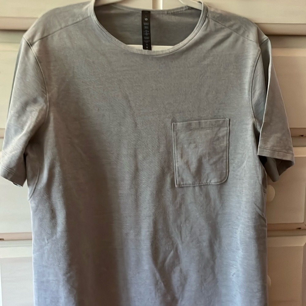 Lululemon pocket t shirt.  Light heather grey color. Excellent condition